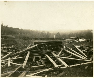 Men search through wreckage after an explosion at a Thomas mine.