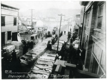 Caskets line the street which served as a makeshift morgue for the miners killed in the explosion at the Fairmont Coal Company Monongah Mines. 