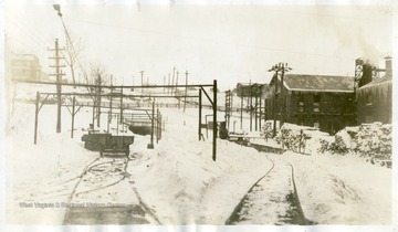 Snow cleared off the tracks and cars near a coal mine entrance in Thomas, W. Va.