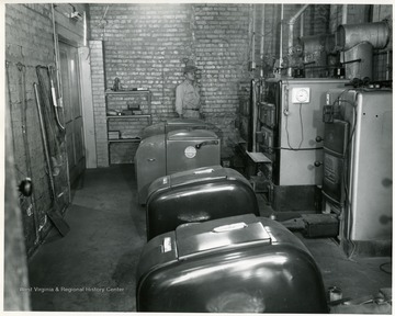 Technician views equipment in a mine lab.