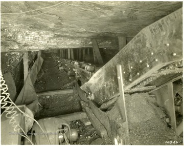 'Loading [sic] from heading to face conveying on 9% grade to boom, coal wet; distance to face 174 feet; flight type boom; Note:  up until the time of taking pictures A-1-A-2-3&amp;4 no jacks were set to support conveyor or drive.'