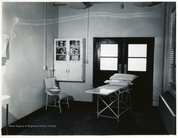 Examination table and medical supplies.