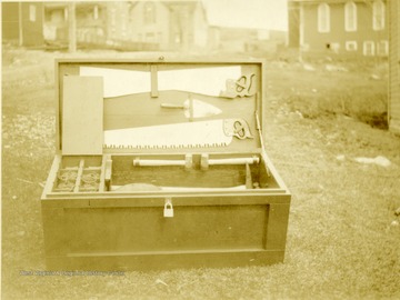 Rescue box with lid open to see contents inside.