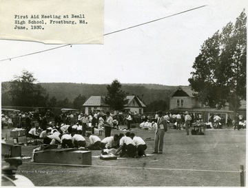 Men practicing first aid techniques at Beall High School in Frostburg.