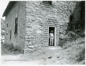 Outside view of the Carlisle Mine Rescue Station with a man standing in the doorway.