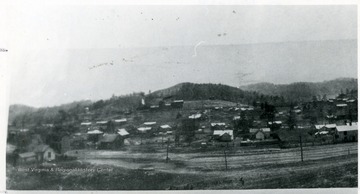 Panoramic view of the town of MacDonald with tipple on the hillside.