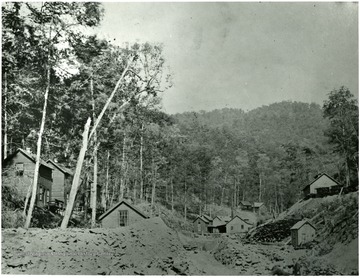 Mining homes with rubble in the streets.