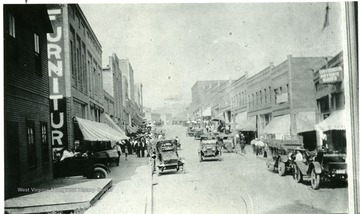 Cars and people file down the streets at Mount Hope, W. Va. 