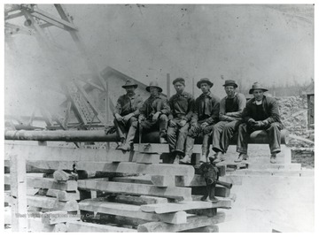 Mine crew building top of mine shaft enclosure at Eccles, W. Va. Sherman A. Clay present. 