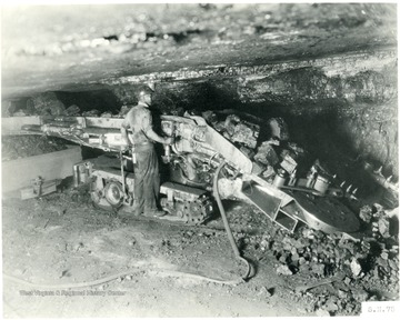 Miner operating a Joy loading machine. 