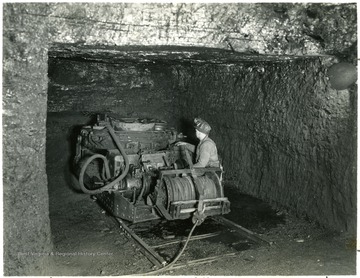 Cutting machine in operation at the Pocahontas Exhibition mine, Pocahontas Va. on the Norfolk and Western Railway. 'Permission is granted to reproduce this photograph only on condition that all reproduction shall bear the following credit line: Photograph by Norfolk and Western Railway.'