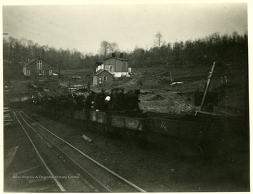 Miners ride out of the mine in Boswell safety cars.