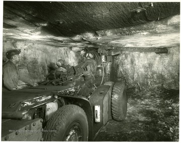 Miner works with cutting machine at Jamison No. 9 mine.