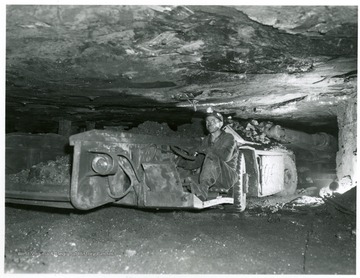 Miner waiting for shuttle car to be loaded.