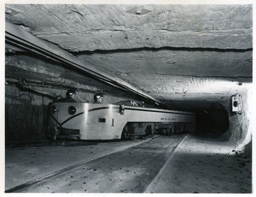 Miners ride in a locomotive at Jamison No. 9.