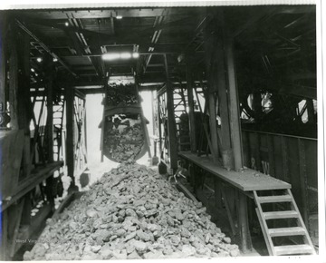 Coal being loaded into train cars.