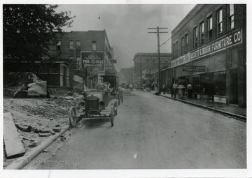 Cars and people in the streets of Logan.