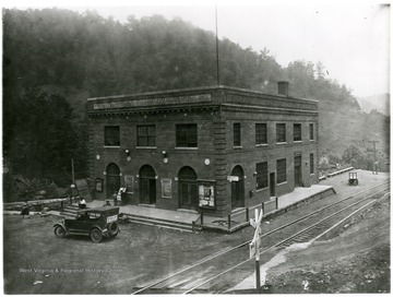 People stand outside of a Pocahontas Fuel Co. building that houses the Post Office.