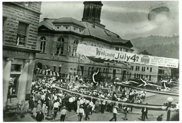 People crowd the streets of Williamson, W. Va. in front of the courthouse on Logan St.