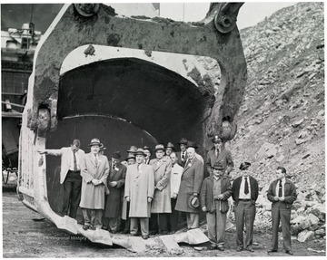 Group portrait of men standing in scoop.