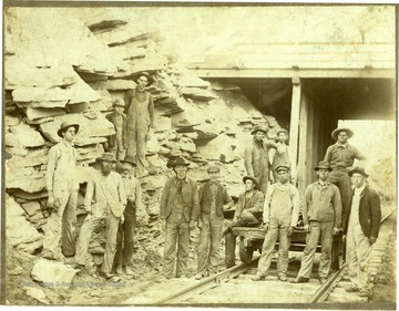 First overhead bridge. Z.W. Lafon, 711 N. Kana St. Z.W. Lafon last man on right, section foreman and assistant road master.