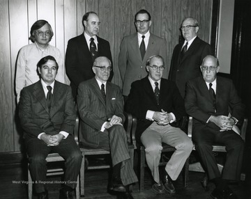 'Front- H.L. Kirkpatrick, S.A. Hunt, E.V. Bowman and S.E. Sparks. Back- Donald M. Reedy (V.P. Planning and Development), O.T. Carr (Secretary and Treasurer), Norville L. Ellison (mgr. stores) and J.M. Wade (Consultant).