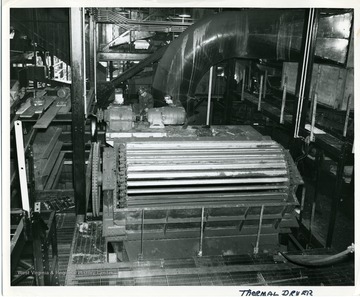 Miners working on a thermal dryer.