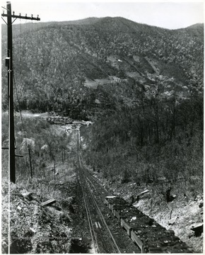 The incline is 4360 feet long and has a vertical rise of 1335 feet. Six cars each carrying 4 tons each would be loaded each trip.