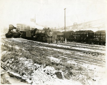 Train engine and filled coal cars outside of the preparation plant at Mine No. 32, Fairmont, W. Va.