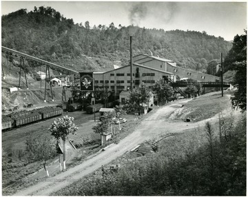 A dirt road leads to an active coal preparation plant.