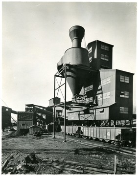 Train cars line up below a coal shute, at the preparation plant.