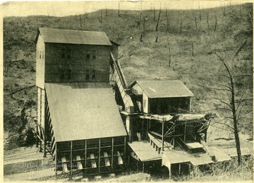 Postcard with a coal buildings on the front.