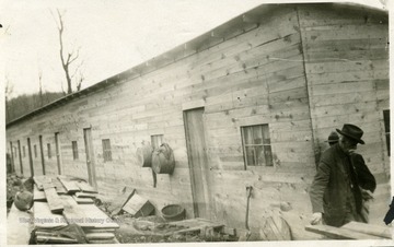 Man standing outside of barracks at Meriden, W. Va.