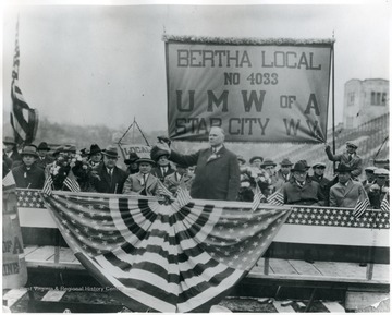 Taken at W. V. U. Stadium, V. Bittner under speaker's hand, speaker unidentifiable 