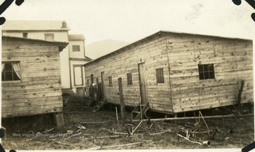 Barracks at Lost Creek, W. Va. and large house behind.