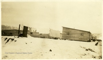 Laundry hanging on line outside barracks at Meadowbrook, W. Va. with snow on the ground.