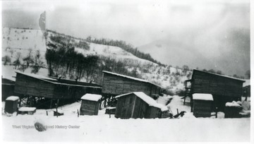 Close-up view of Jamison No. 9 barracks taken on a snowy winter day.