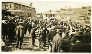 Crowd in street possibly for a labor demonstration.