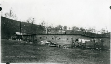 Laundry hanging in front of barracks.