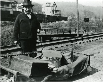 Picture of an evicted coal miner with his belongings.