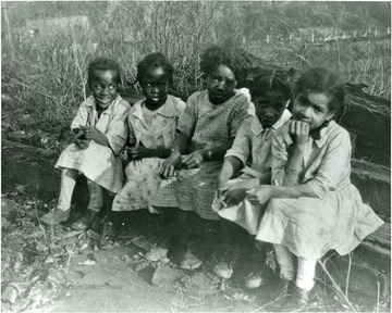 Picture presents unidentified childen at playground.