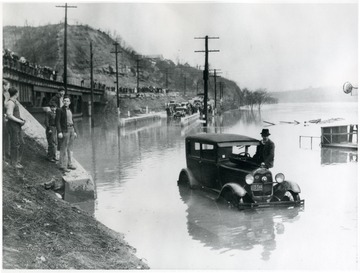 Car trapped in flood waters.