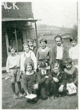 Group portrait of boys in front of 'The Shack'. 'For information on the Mountaineer Mining Mission See A&amp;M 2491 (S.C.).'