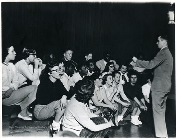 Rev. Walter Case leading choir in song at the Shack, Pursglove, W. Va., Monongalia County. 'For information on the Mountaineer Mining Mission, See A&amp;M 2491 (S.C.).'