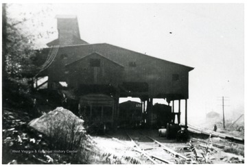 Tipple with railroad cars underneath.