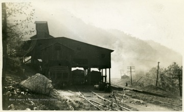 Tipple with railroad cars underneath.