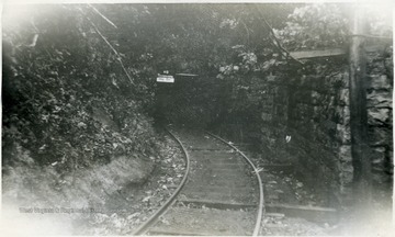 No Trespassing sign is at the entrance to the tunnel.