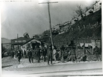 Works Progress Administration workers stand near the tipple and railroad tracks at Pursglove, W. Va. 'For more information on the Mountaineer Mining Mission see A&amp;M 2491 S.C.'