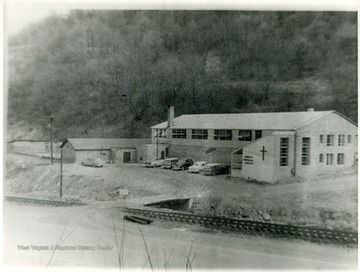 Cars parked outside the Miners Memorial Center. 'For more information on Mountaineer Mining Mission see A&amp;M 2491 (S.C.)'