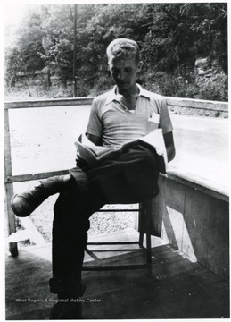 Bill Ellis reading a book.